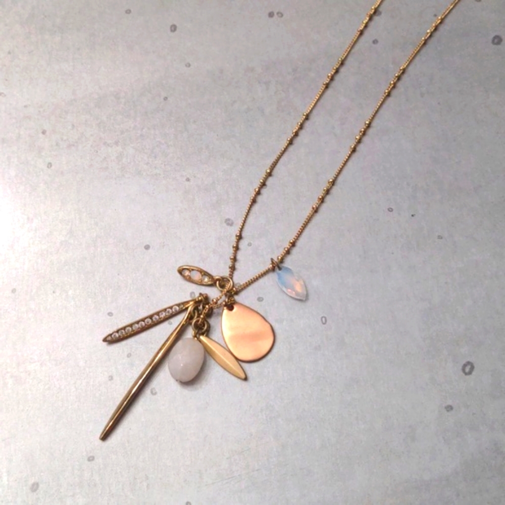 very long gold charm necklace